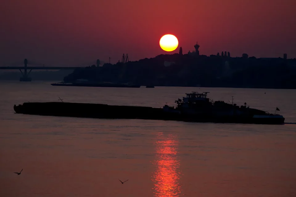 The sun rises over the Danube